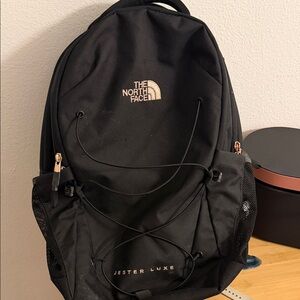 The North Face Jester Luxe Backpack in Black with Gold Accents
